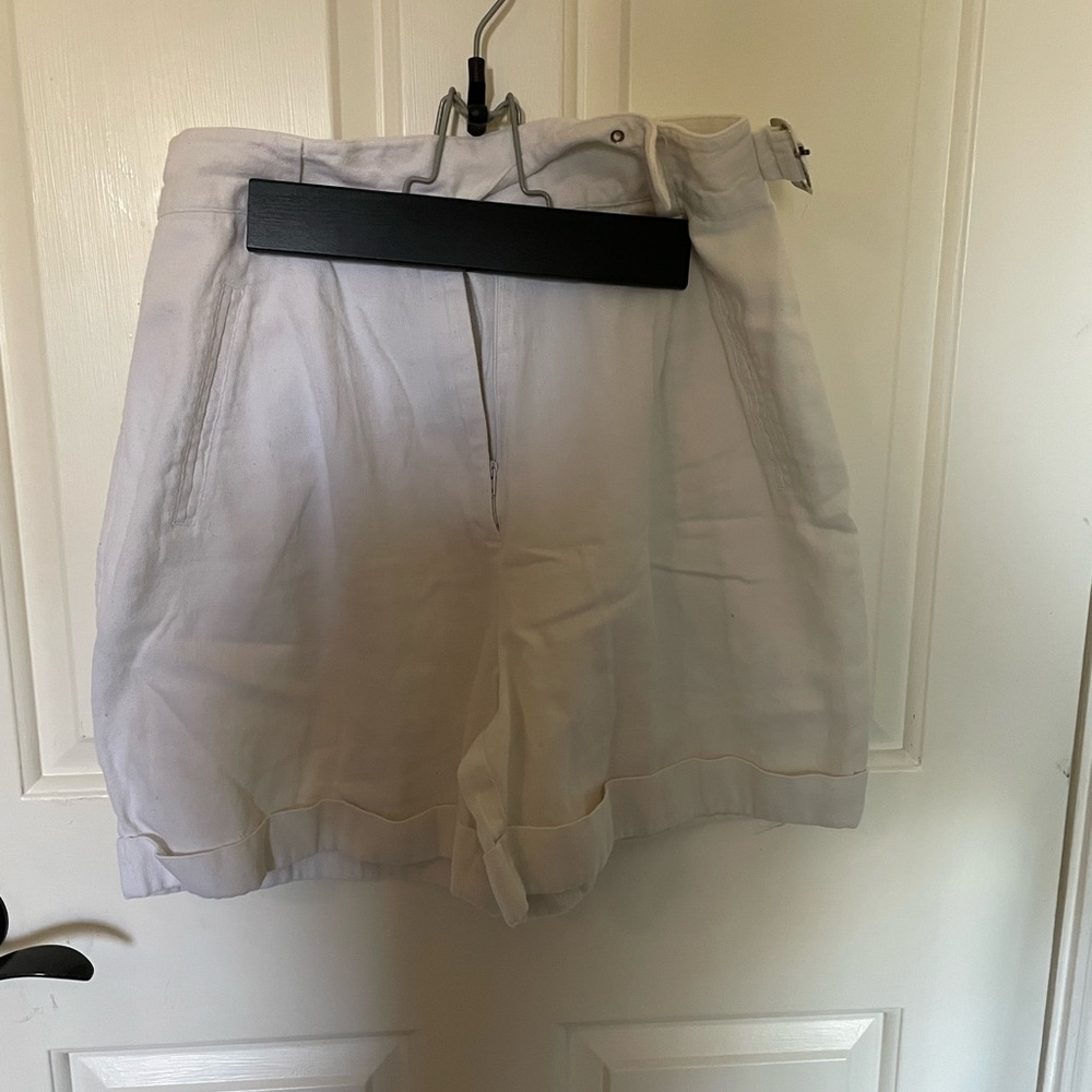 white baggy shorts with built in belt